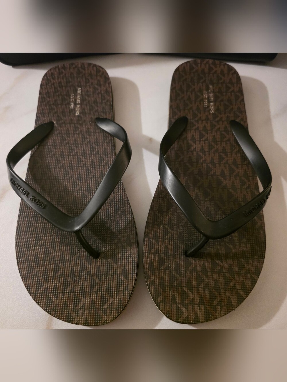 Michael Kors Men’s Brown MK Monogram Flip Flops with Black Straps